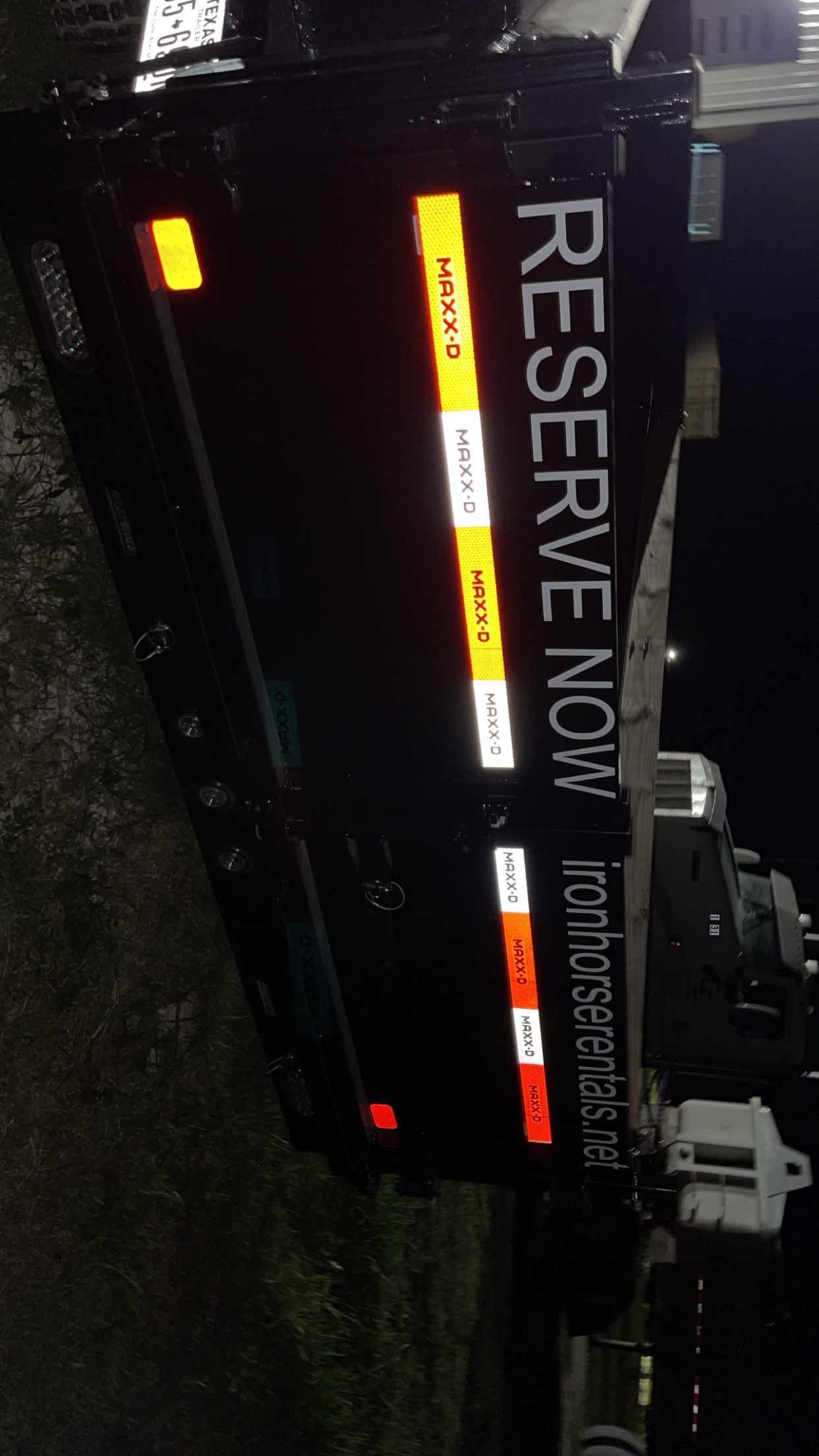 Maxx-D dump trailer reflective tailgate decal at night