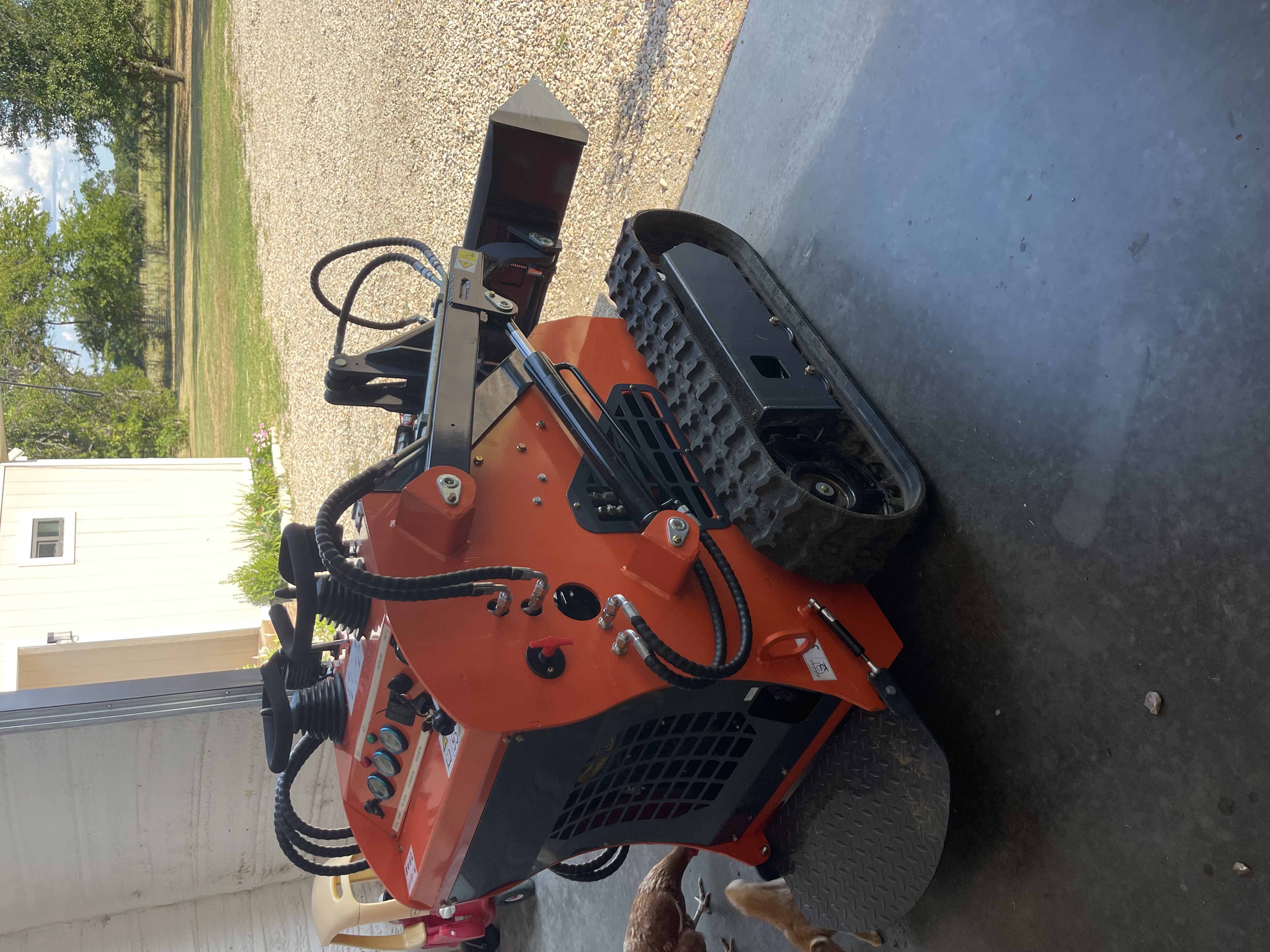 Mini skid steer rubber track and engine bay detail