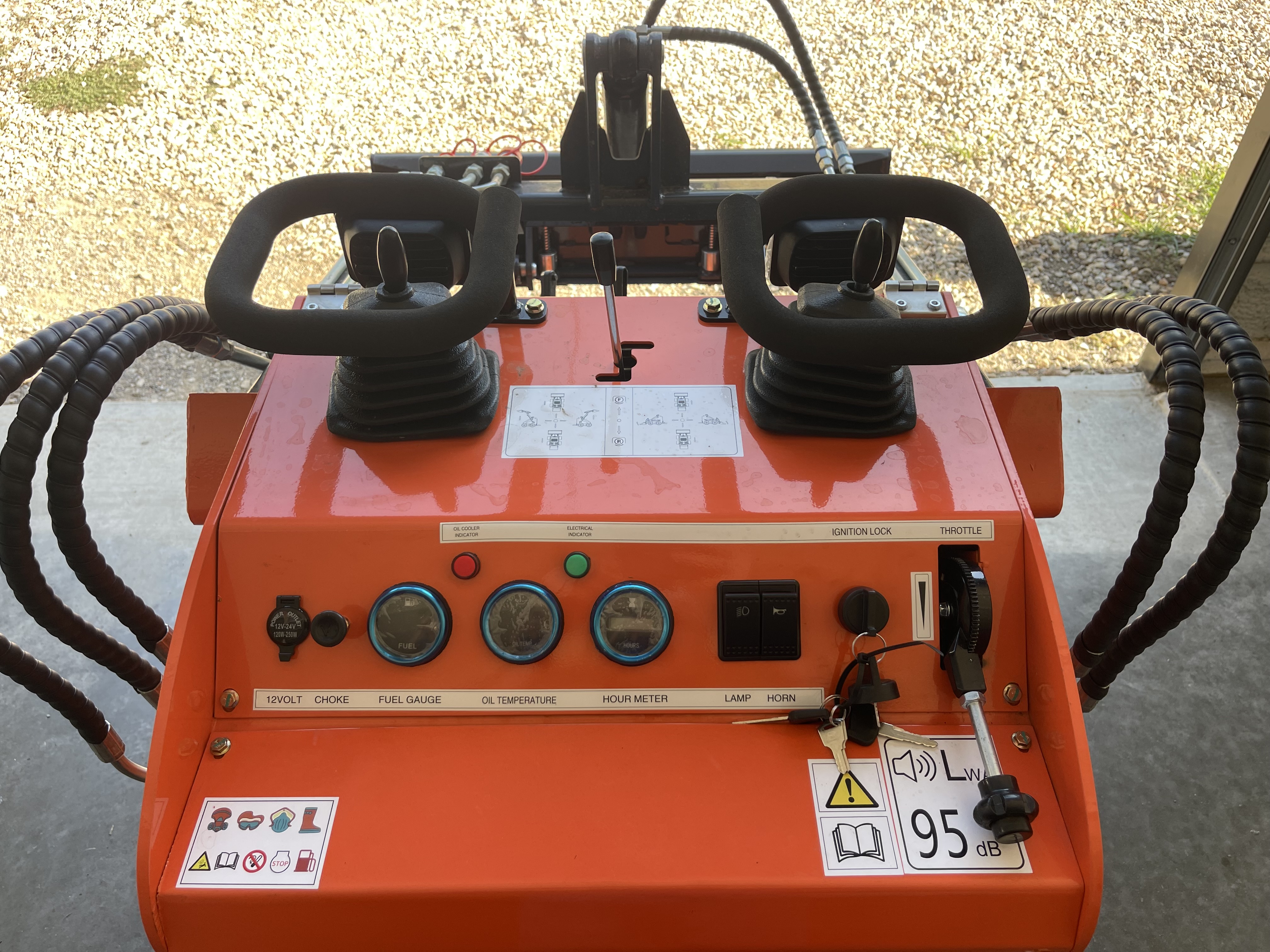 Mini skid steer joystick controls and instrument panel