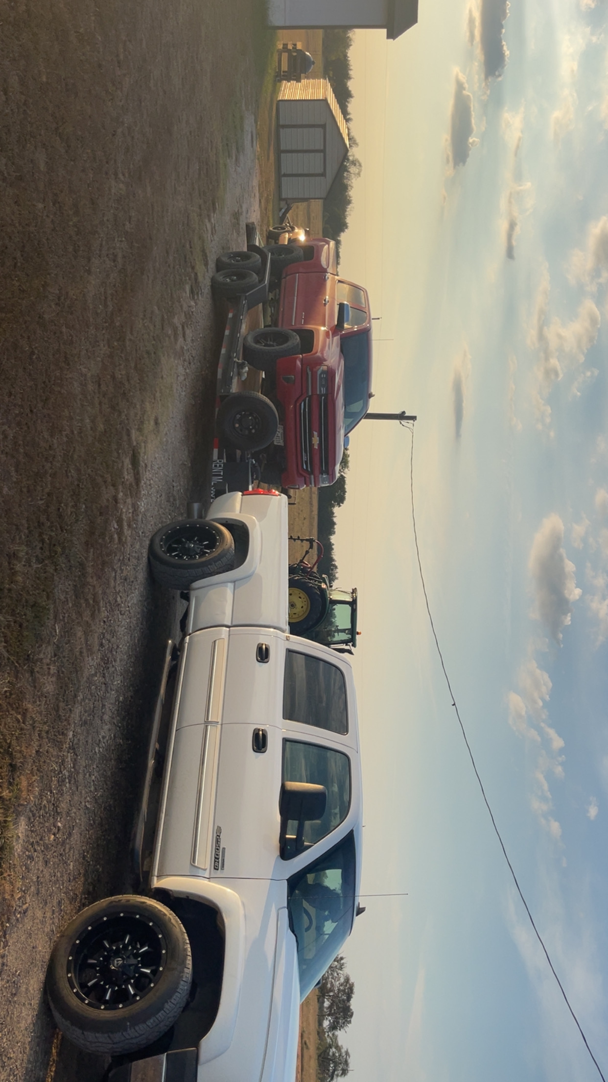 Iron Horse Rentals fleet and tractor at sunset